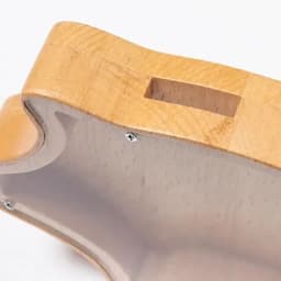 A wooden product with a smooth finish and a slot, showcasing natural wood grain and light colour tones.