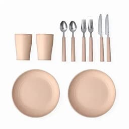 A dining set featuring two beige plates, cups, and metal cutlery with beige handles. It includes forks, knives, and spoons.