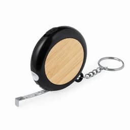 A tape measure with a black and bamboo exterior, featuring a keychain attachment and retractable measuring tape.