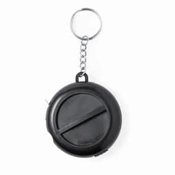 A compact black tape measure with a keychain attachment. Circular design for easy portability.