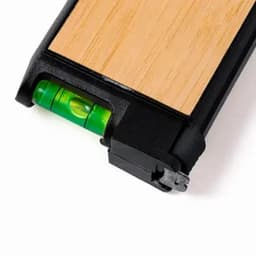 A level tool with a wooden top and black edges, featuring a small green bubble level indicator.