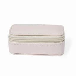 A small rectangular storage case in soft pink, featuring a zip closure and contrasting cream lining.