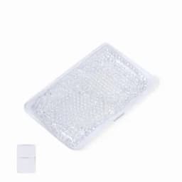 A rectangular, clear gel pack with a textured surface, accompanied by a small white container.