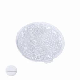 A round, white gel pack with a textured surface, designed for therapeutic use. A small disc is also included.