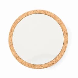 A round mirror with a natural cork frame, featuring a smooth, reflective surface.