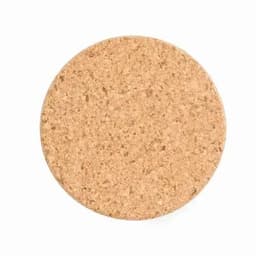 A cork coaster with a natural beige colour and textured surface. It has a round shape.