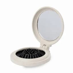 A compact mirror with a round design, featuring a reflective surface and storage for small items inside. It has a white colour.