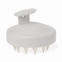 A grey hair scrubber with a rounded top and spiked underside, featuring a simple design and a small handle.