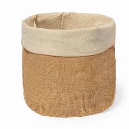 A storage basket made of brown jute with a light beige fabric rim, featuring a simple, rustic design.