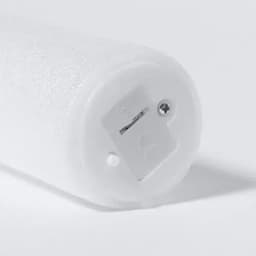 A white drink bottle with a textured surface and a base featuring a logo and a secure opening mechanism.