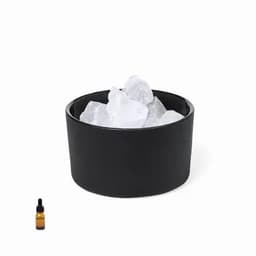 A black drink container filled with ice and a small amber glass dropper bottle beside it.