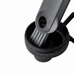 A drink bottle in black and grey with a segmented cap and a brush attachment inside. It has a logo on the side.