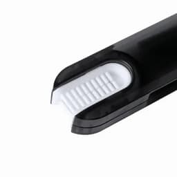 A toothbrush with a sleek black handle and a white brushing head, featuring a logo on the side.