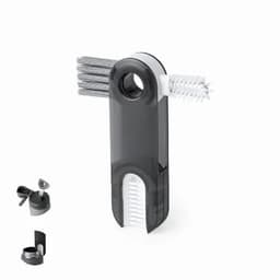 A cleaning tool with multiple brushes, featuring a grey and white design, and a compact holder.