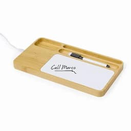 A bamboo desk organiser featuring sections for a pen and a notepad with handwritten text.