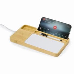 A bamboo docking station featuring a phone holder, a pen, and a white surface for notes. Includes a charging cable.