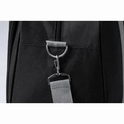 A black bag featuring a zipper and a metal clip attachment. The material is textured and durable.