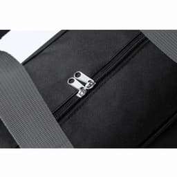 A black bag featuring a silver zip and grey strap, showcasing the zipper detail prominently.