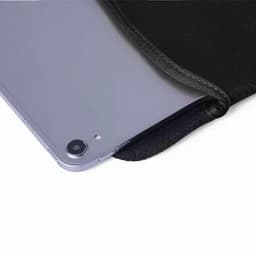 A tablet partially inside a black protective sleeve, showcasing the device's camera and sleek edge.