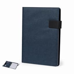 A navy blue notebook with a black strap, accompanied by a notepad and pen, featuring a minimalist design.