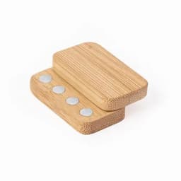A bamboo product with two stacked blocks featuring four metal discs, showcasing a natural finish and smooth texture.