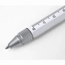 A pen with a silver tip and a ruler printed along its body, featuring a textured grip.