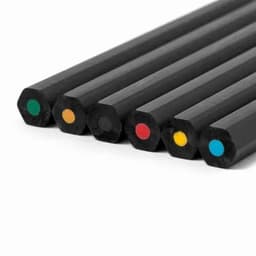 A set of six hexagonal black pencils with coloured tips in green, orange, red, yellow, blue, and one black tip.