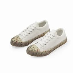 A pair of white sneakers with a multi-coloured speckled sole. The shoes feature a classic lace-up design.