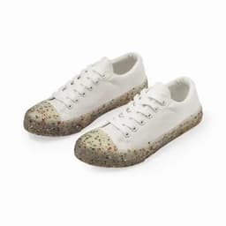 A pair of white sneakers with a speckled rubber sole, featuring a rounded toe and lace-up design.