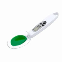 A digital thermometer with a white handle and a transparent scoop, containing green gel inside.