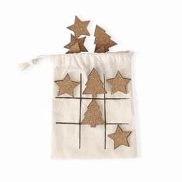 A cotton bag containing cork star and tree shapes for a game, with additional shapes displayed above the bag.