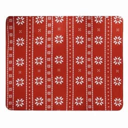 A festive red mat featuring white snowflake patterns and stripes. It has a decorative design suitable for seasonal decor.