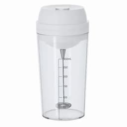 A drink bottle in clear plastic with a white lid and a built-in mixing whisk. It features measurement markings.