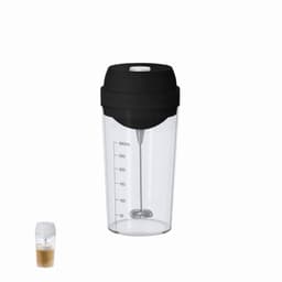 A drink bottle with a clear body, black lid, and a built-in frother, featuring measurement markings.
