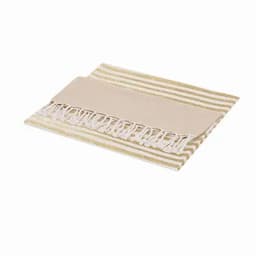 A beach towel with a striped gold and cream design, featuring a fringed edge and a plain section.