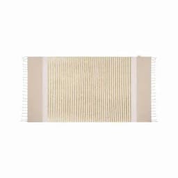 A woven rug featuring a cream and beige design, with fringed edges and textured stripes. It has a simple, natural look.
