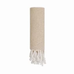 A rolled beige fabric towel with white fringes at one end and a textured pattern.