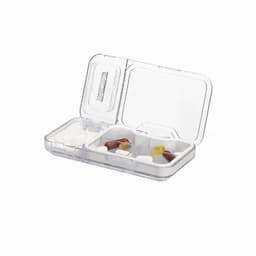A clear pill organiser with two compartments containing various tablets and capsules.