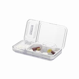 A pill organiser with a clear plastic case, containing various capsules and tablets in separate compartments.