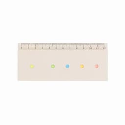 A ruler with a smooth surface featuring four coloured dots: yellow, green, blue, and pink, with measurement marks.