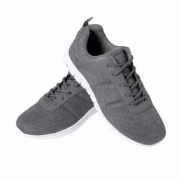 A pair of grey athletic shoes with a mesh texture and white soles, featuring laces and a small heel tab.