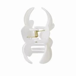 A white product with a spring mechanism, featuring a two-part design resembling a clip or clamp.