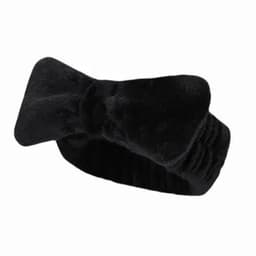 A black headband featuring a bow design, made from soft, textured fabric. It has an elastic section for comfort.