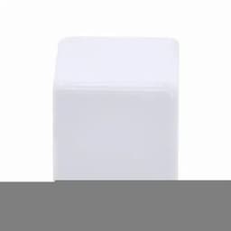 A white cube-shaped ice block on a flat surface, with a smooth finish.