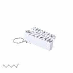 A compact white folding ruler attached to a keychain, featuring measurement markings on both sides.
