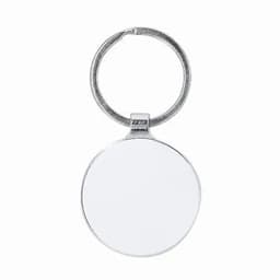 A keyring featuring a round, silver pendant with a blank surface, suitable for custom designs or engravings.