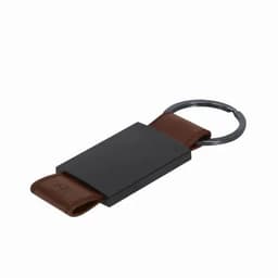 A keychain with a black rectangular holder and a brown leather strap, featuring a metal ring.