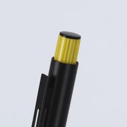 A black pen with a textured yellow cap and clip, featuring a simple design and sleek finish.