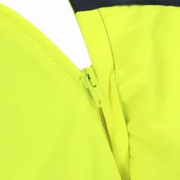 A close-up of a bright yellow jacket featuring a zippered closure and contrasting dark fabric at the neckline.