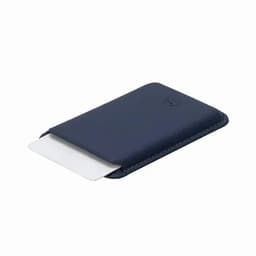 A navy business card holder with a streamlined design, featuring a logo on the front and a card partially visible.